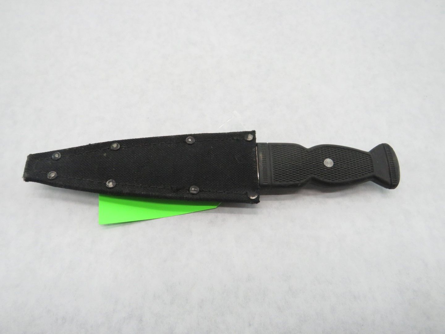 Black knife in a sheath.