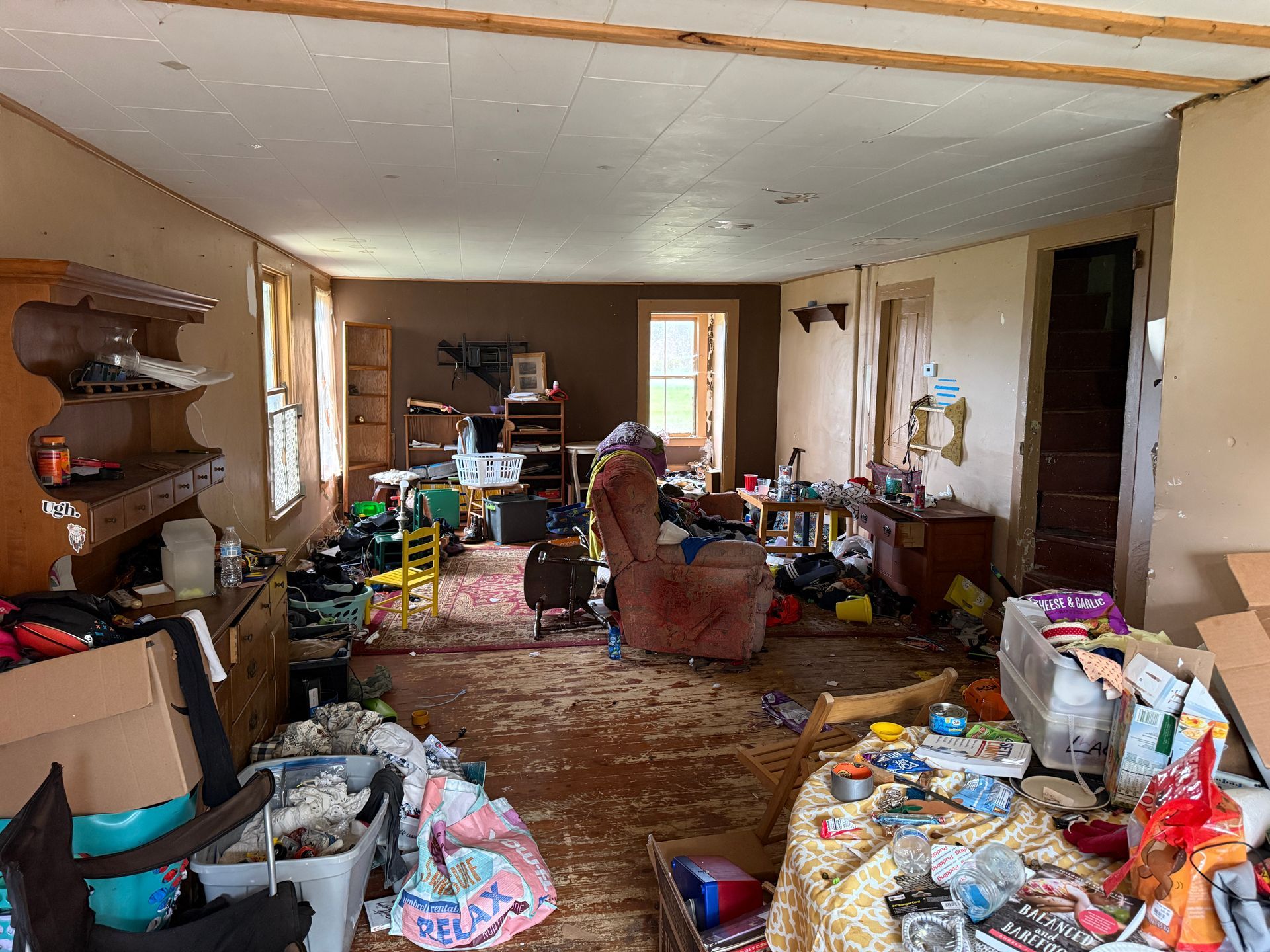 Room with tan walls and carpeted flooring.