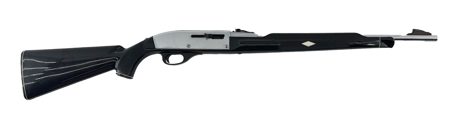 Shotgun with a silver receiver and black stock, barrel, and fore-end.
