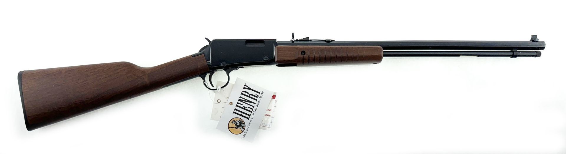 A long, brown lever-action rifle on a white background, with a tag attached.