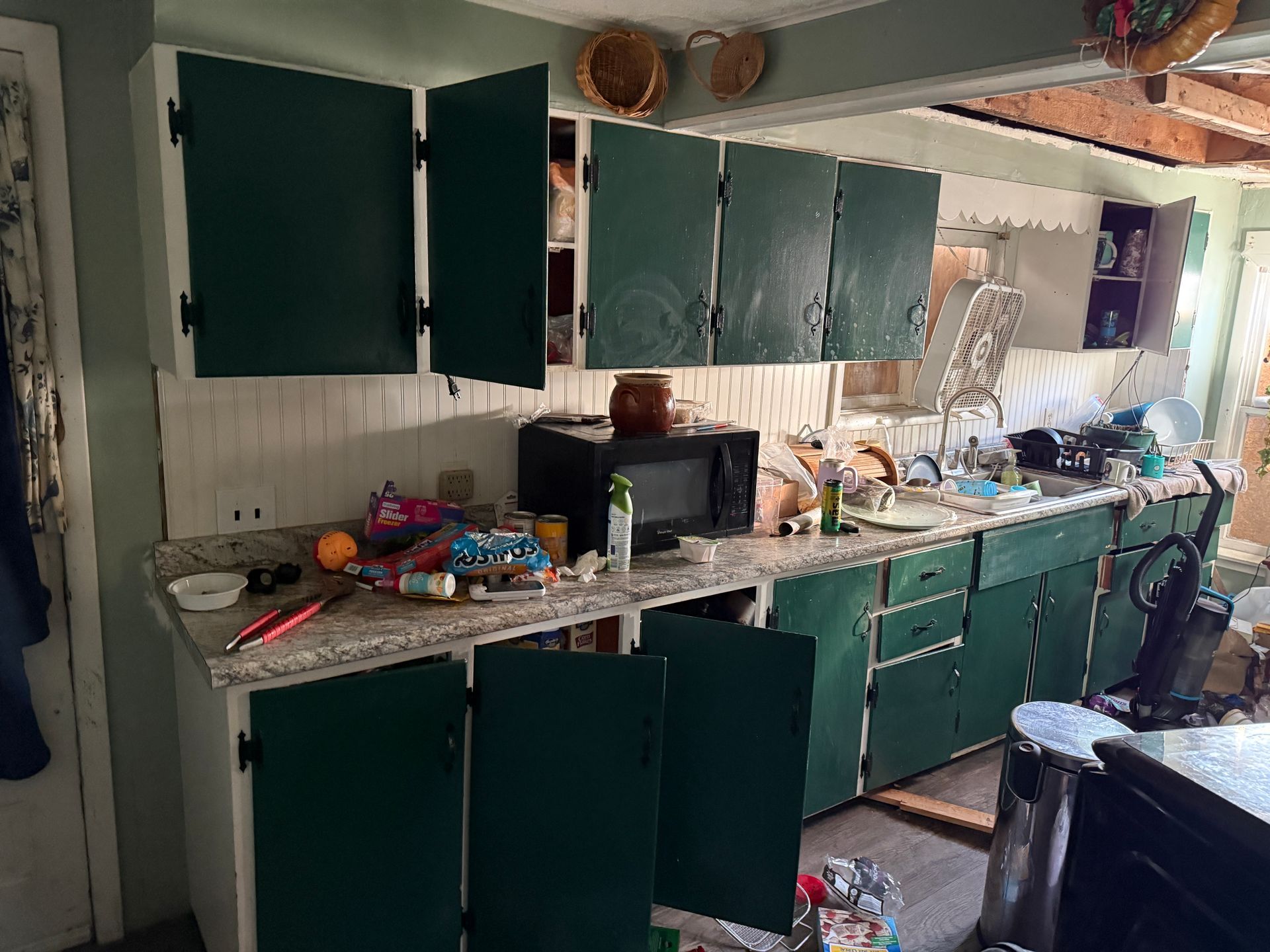 A kitchen with green accents.