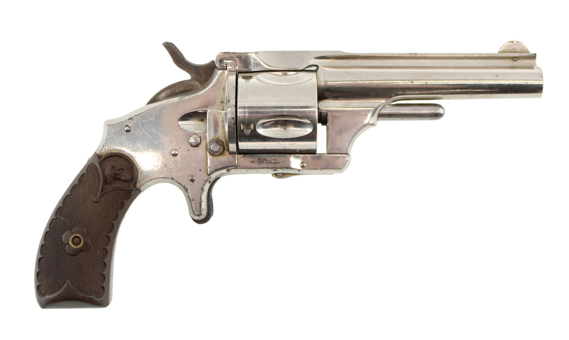 Vintage silver revolver with a dark wooden grip, side view on a white background