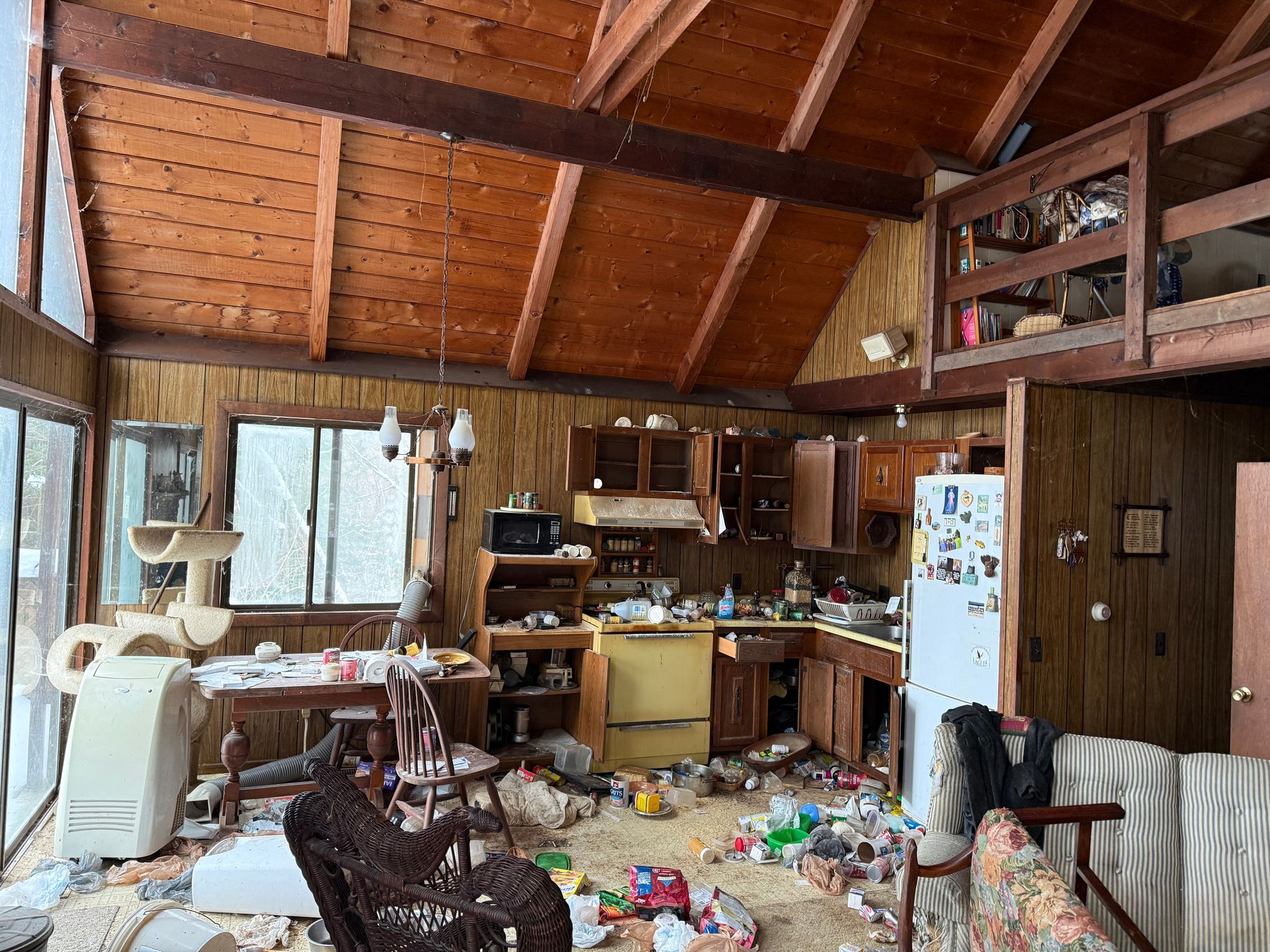 Interior of a cabin kitchen and living area.