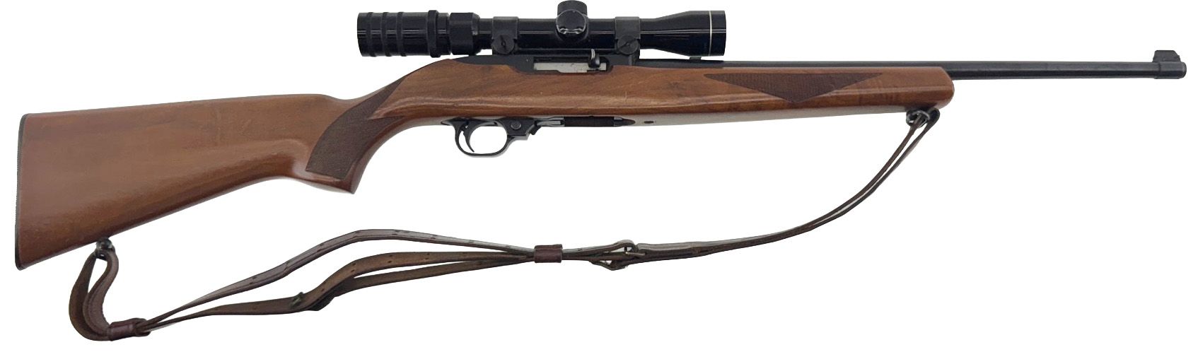 Brown rifle with a scope, and carrying strap.