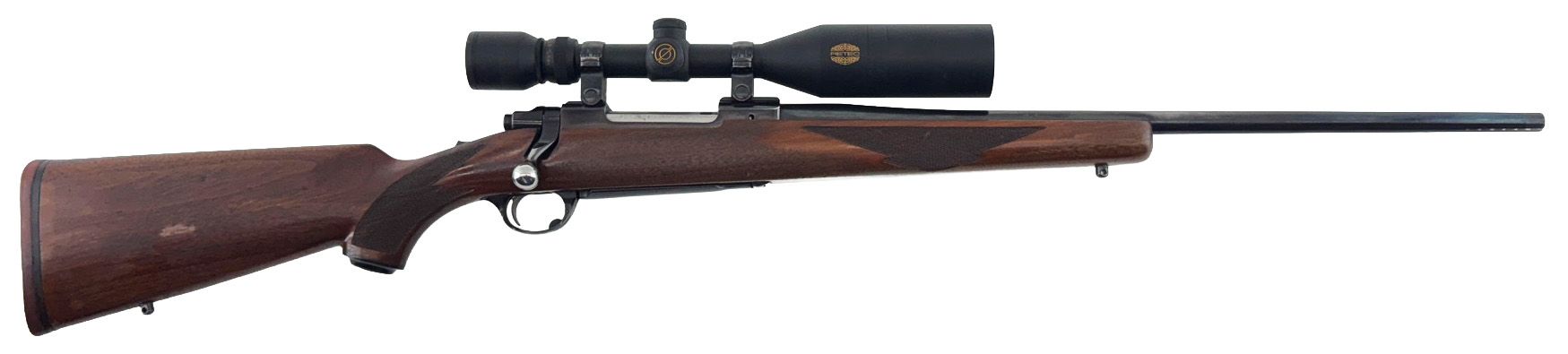 A bolt-action hunting rifle with a scope, wooden stock, and dark metal barrel.