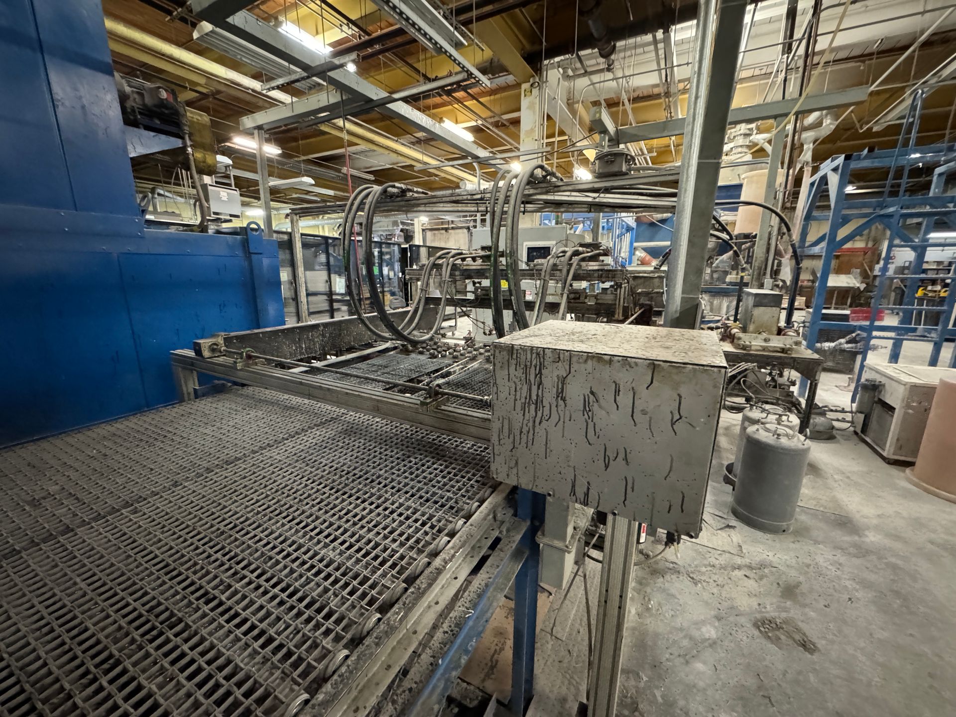 Industrial machine with conveyor belt.
