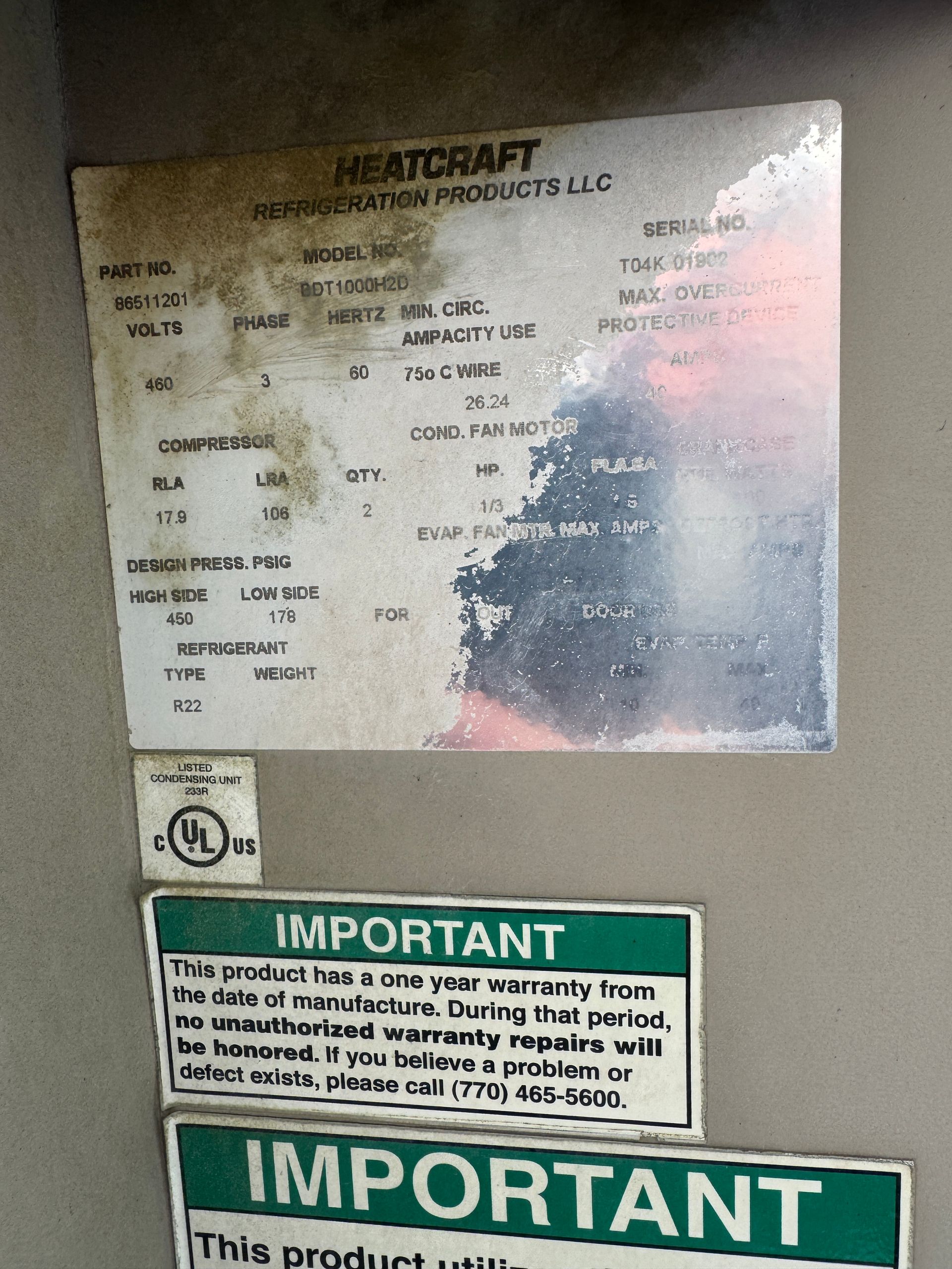 Heatcraft refrigerator tag with information. Below are two green 