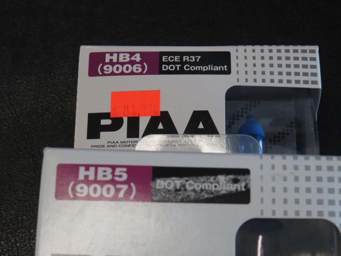 Boxes labeled PIAA HB4 (9006) and HB5 (9007) with DOT compliant stickers.