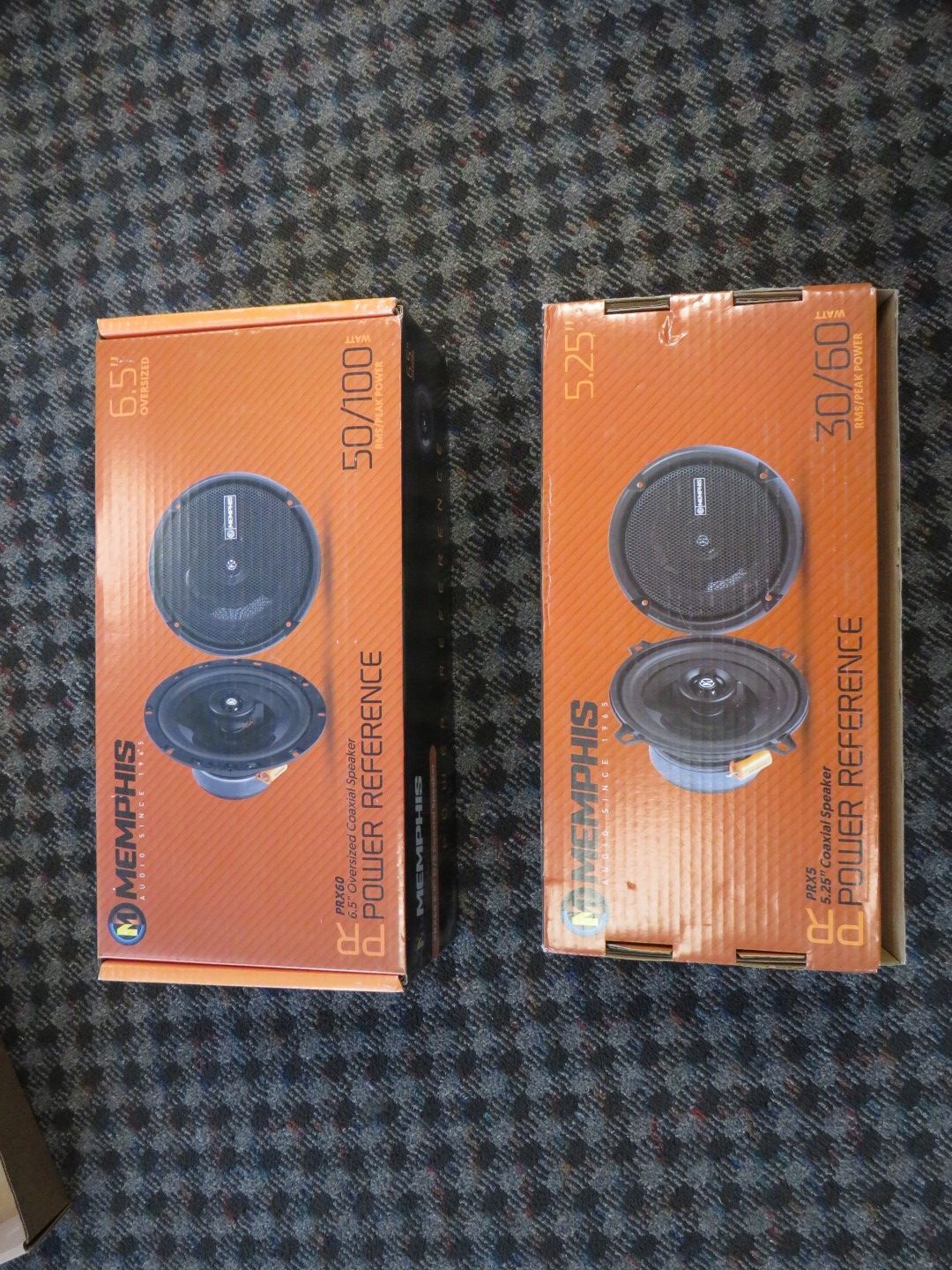 Two orange boxes with Memphis speakers. One is 6.5
