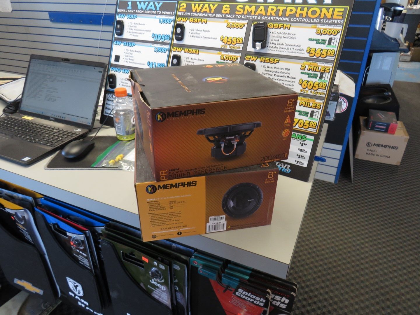 Two Memphis subwoofer boxes stacked on a counter.