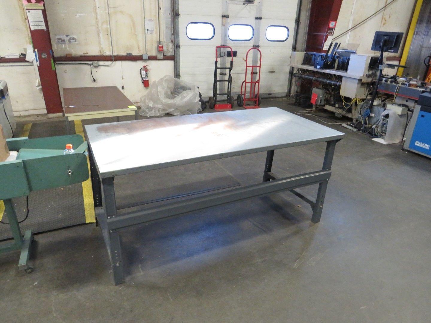 Gray metal workbench in a workshop.