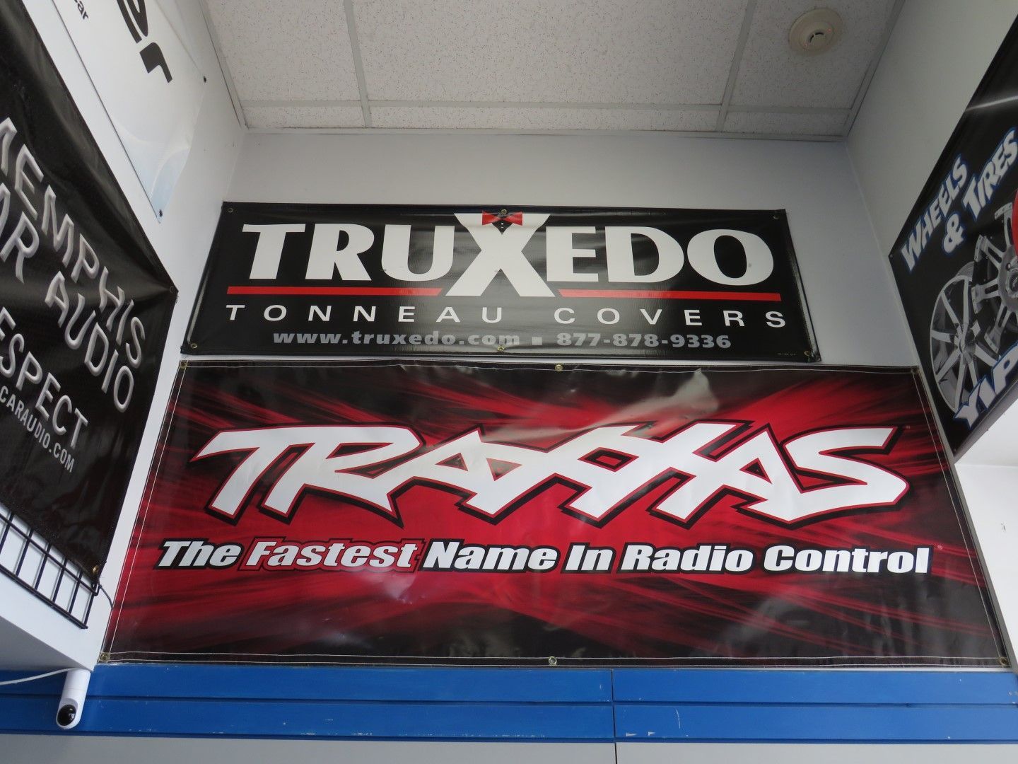 Two banners: Truxedo tonneau covers and Traxxas, 