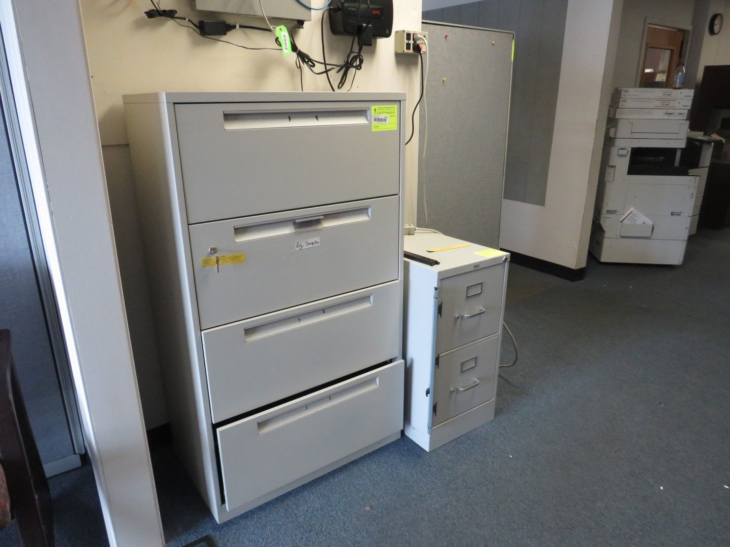 Four-drawer and two-drawer filing cabinets in an office setting.