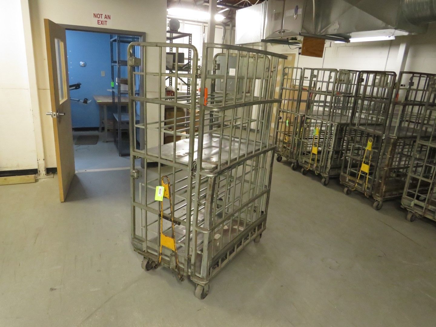Metal rolling storage carts in a warehouse.