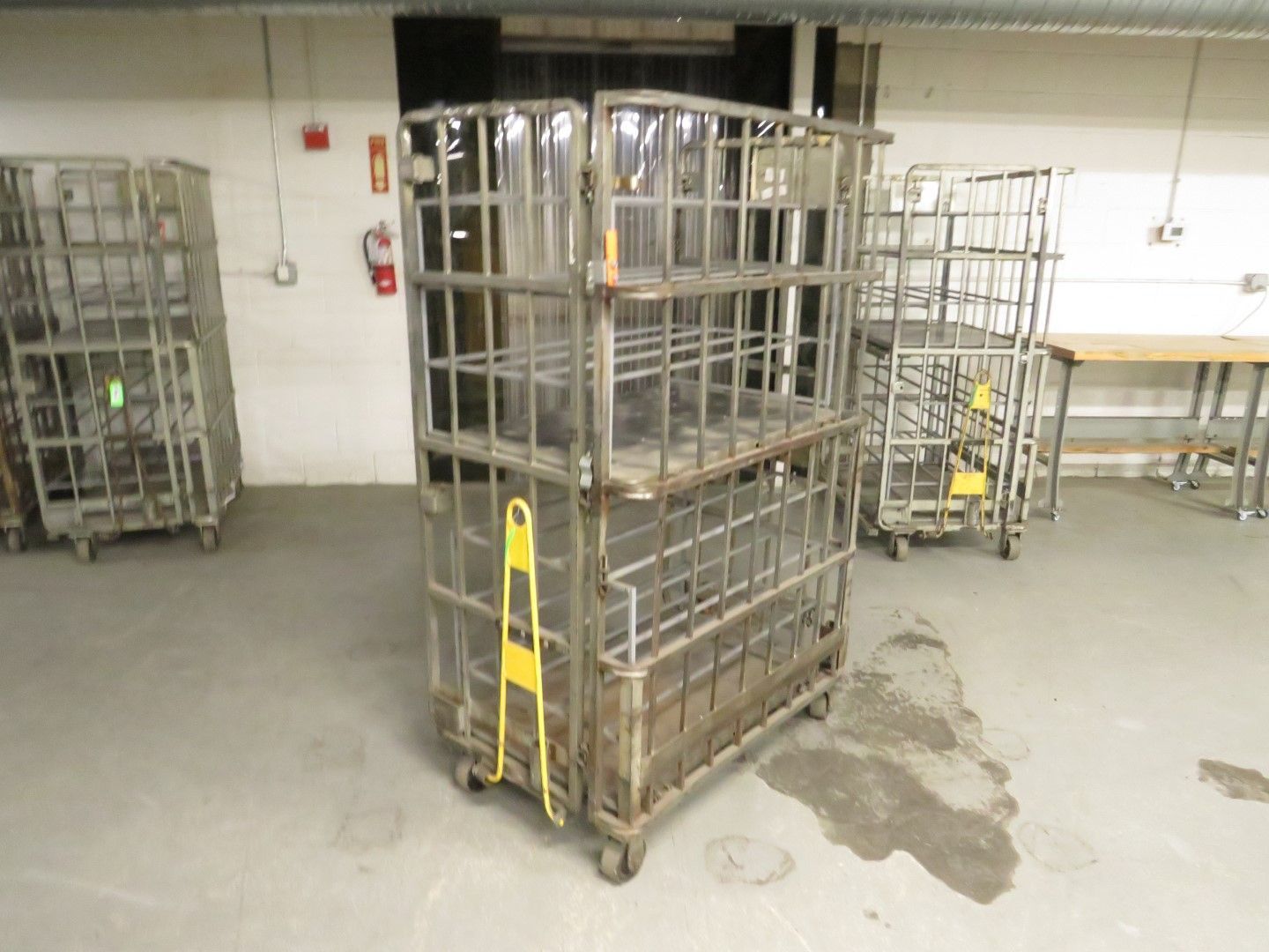 Metal rolling storage carts in a warehouse.