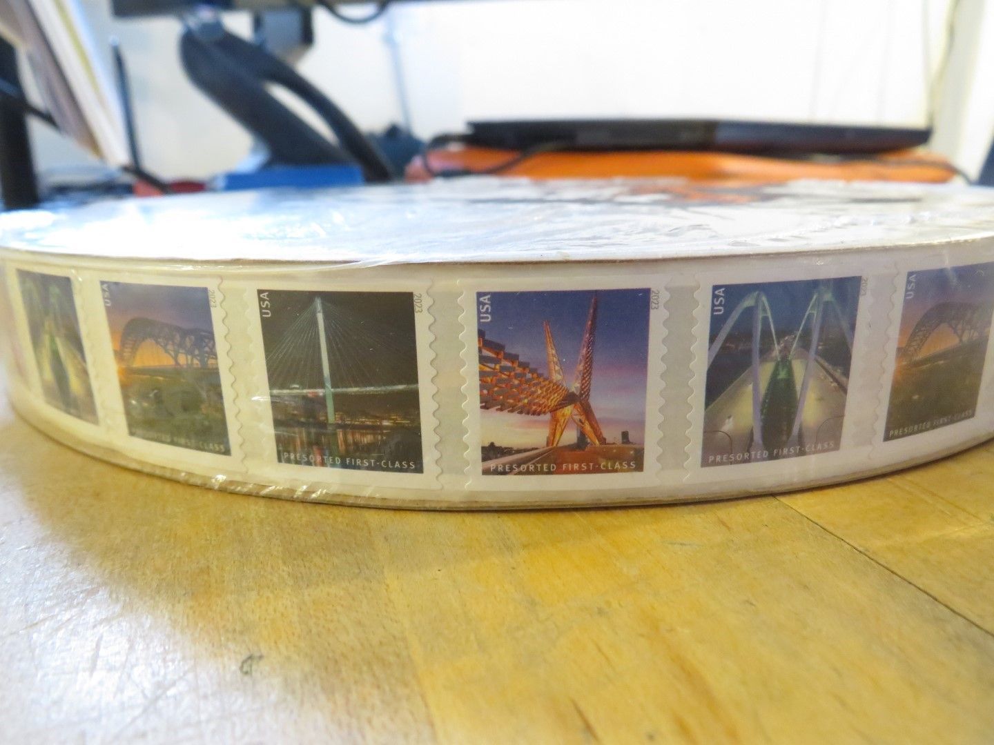Roll of stamps featuring architectural structures.