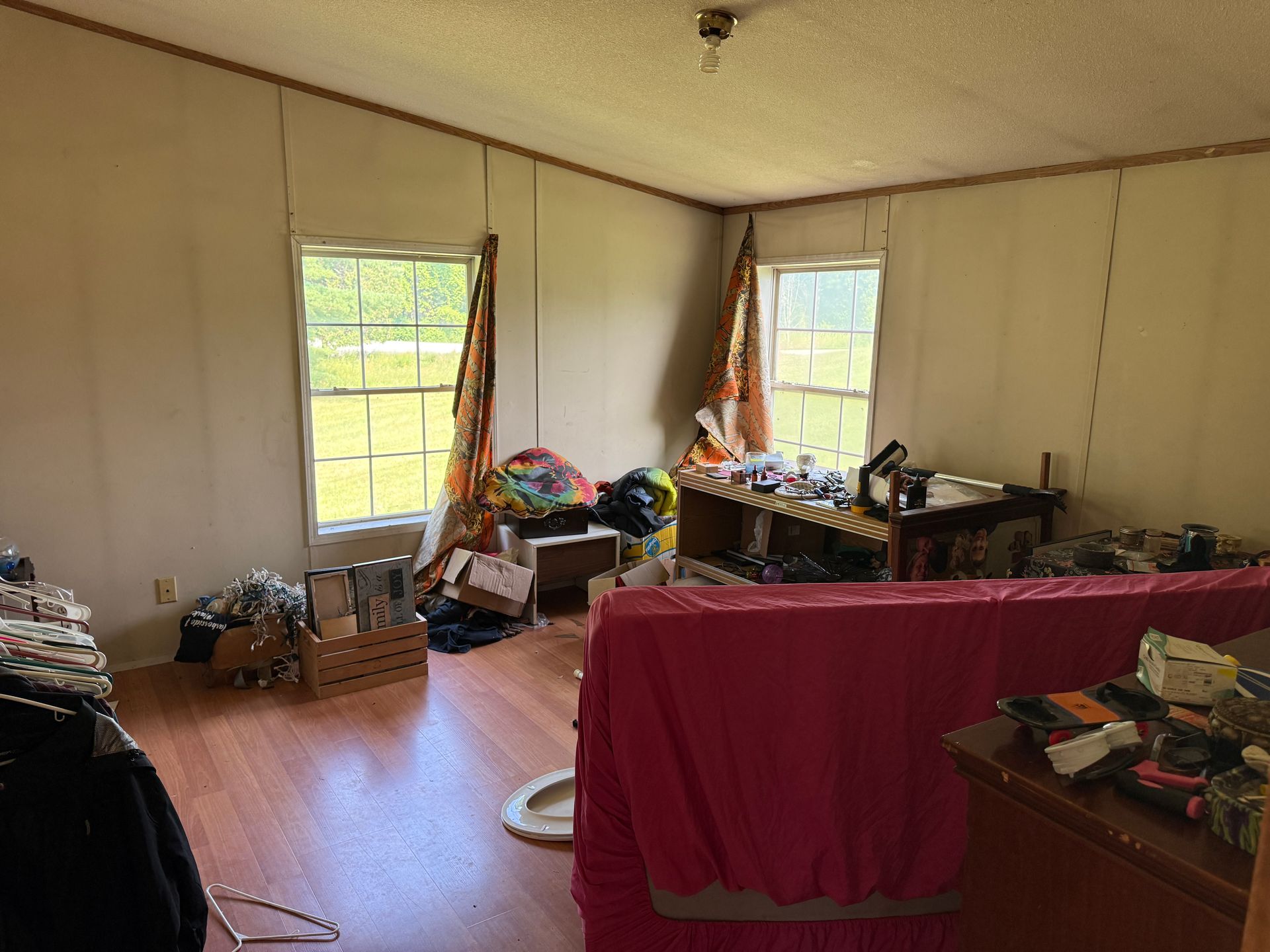 room with two windows, tables