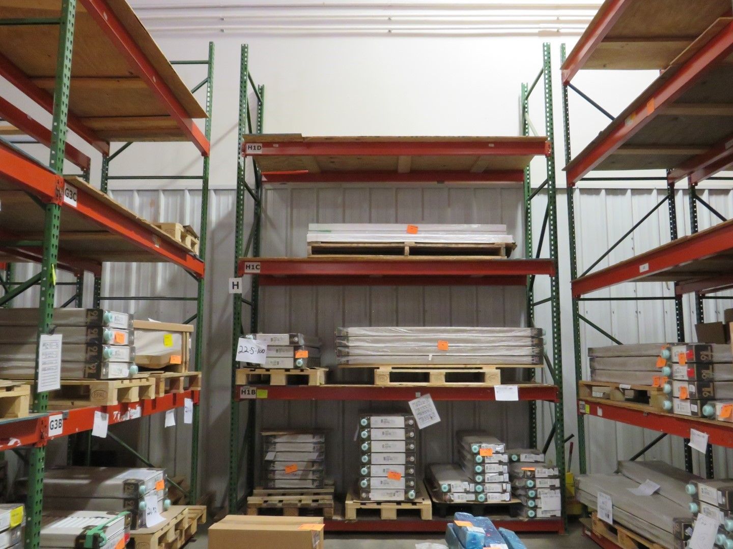 Warehouse shelving loaded with building materials.
