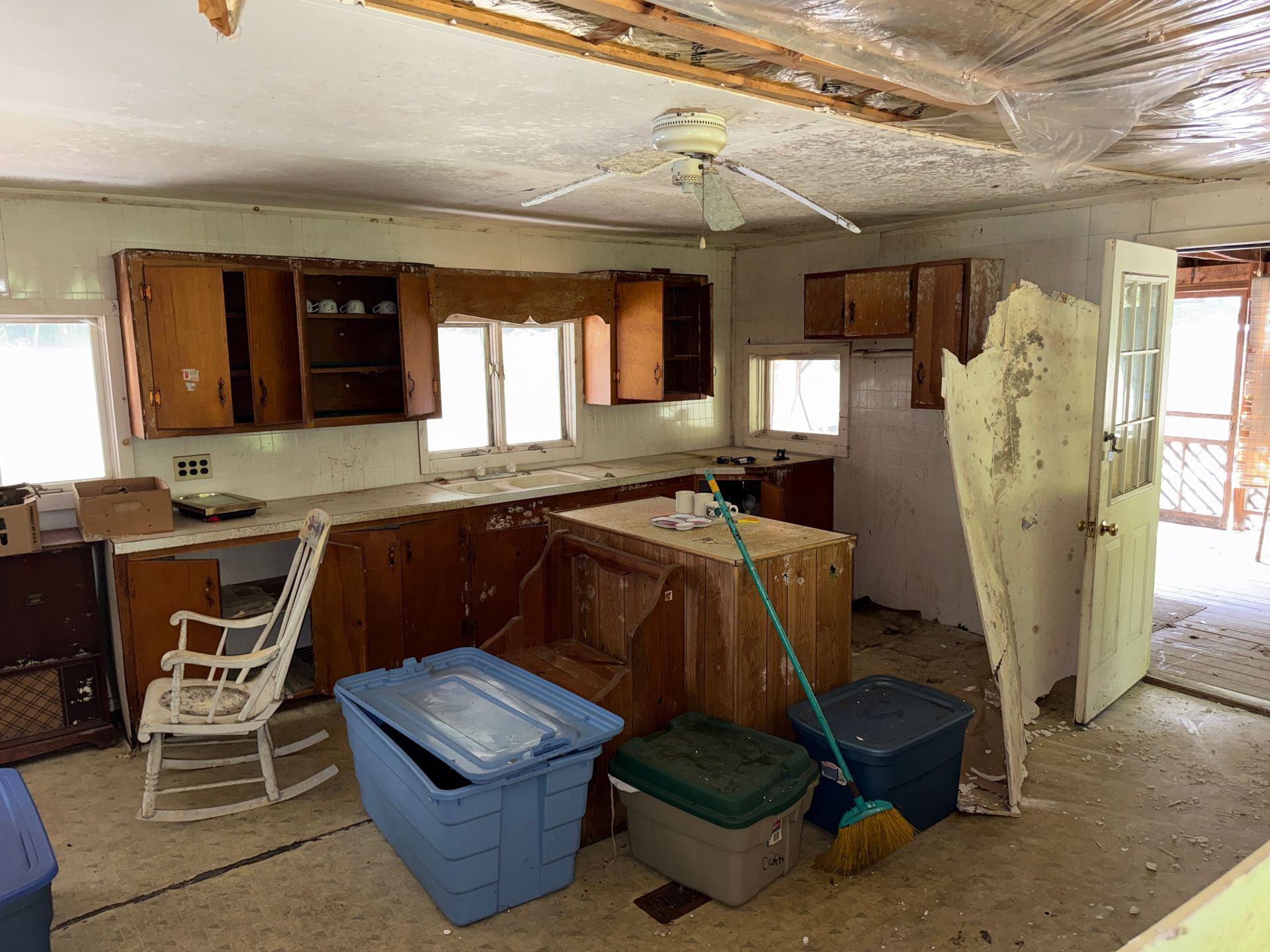 kitchen with cabinets, chairs, storage bins