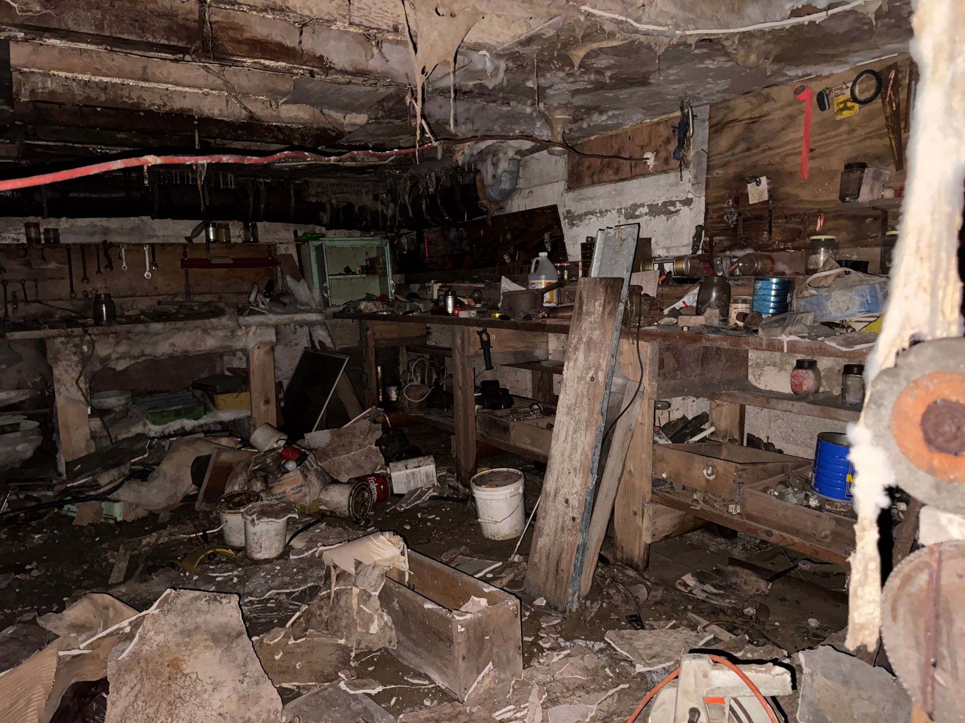 basement workshop with shelves, tools