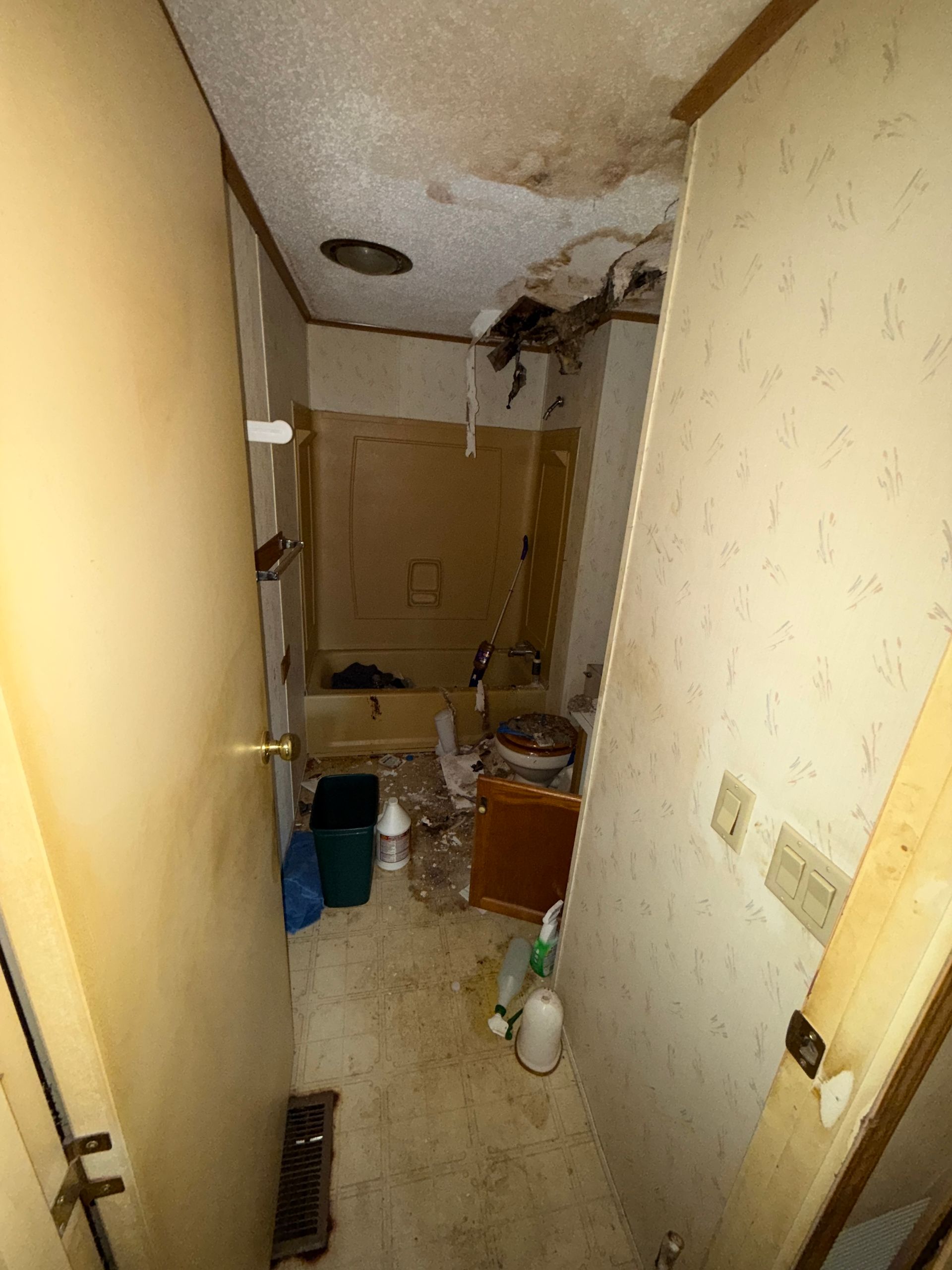 narrow hallway with beige wallpaper