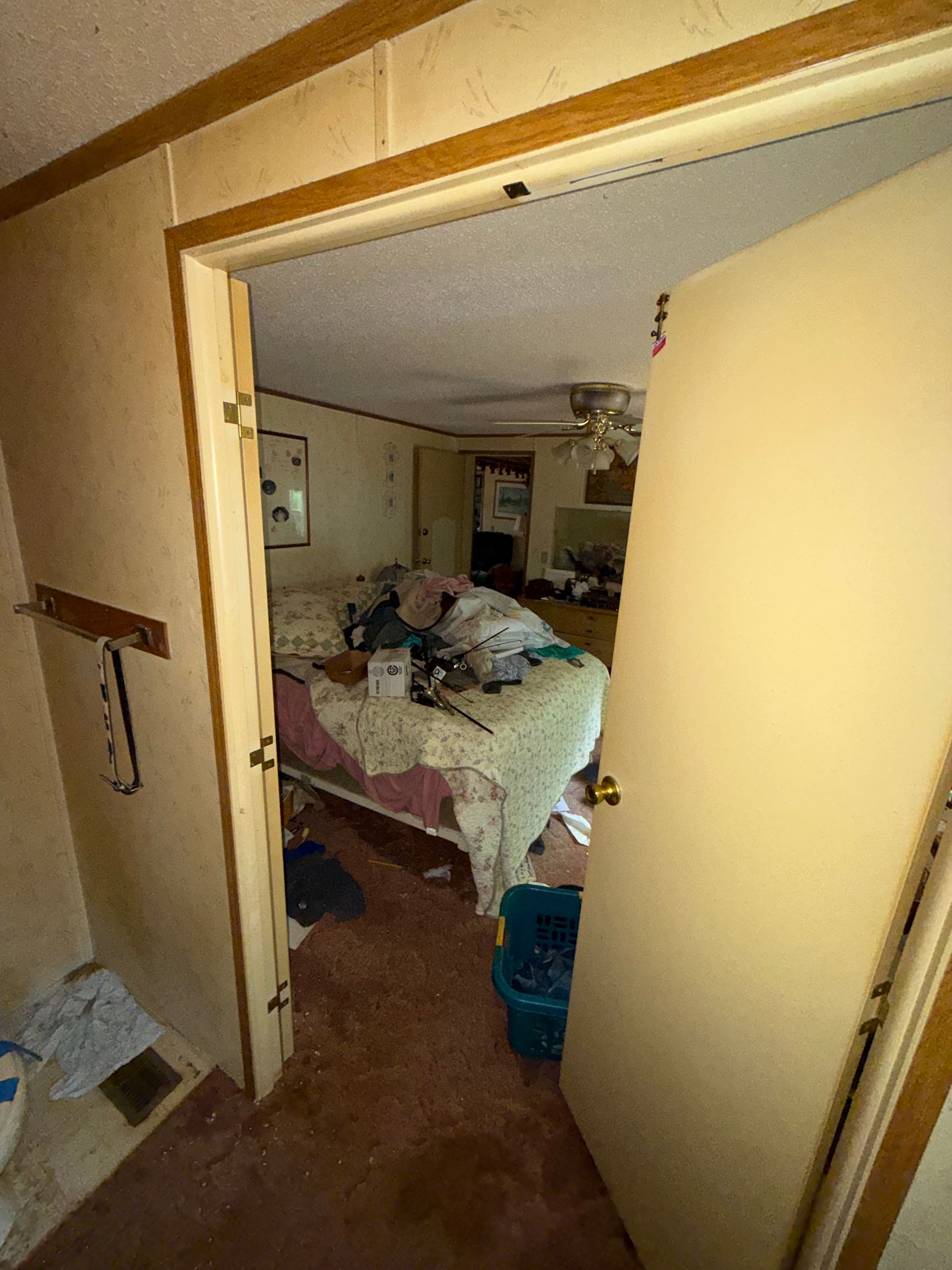bedroom viewed through a doorway, with a bed