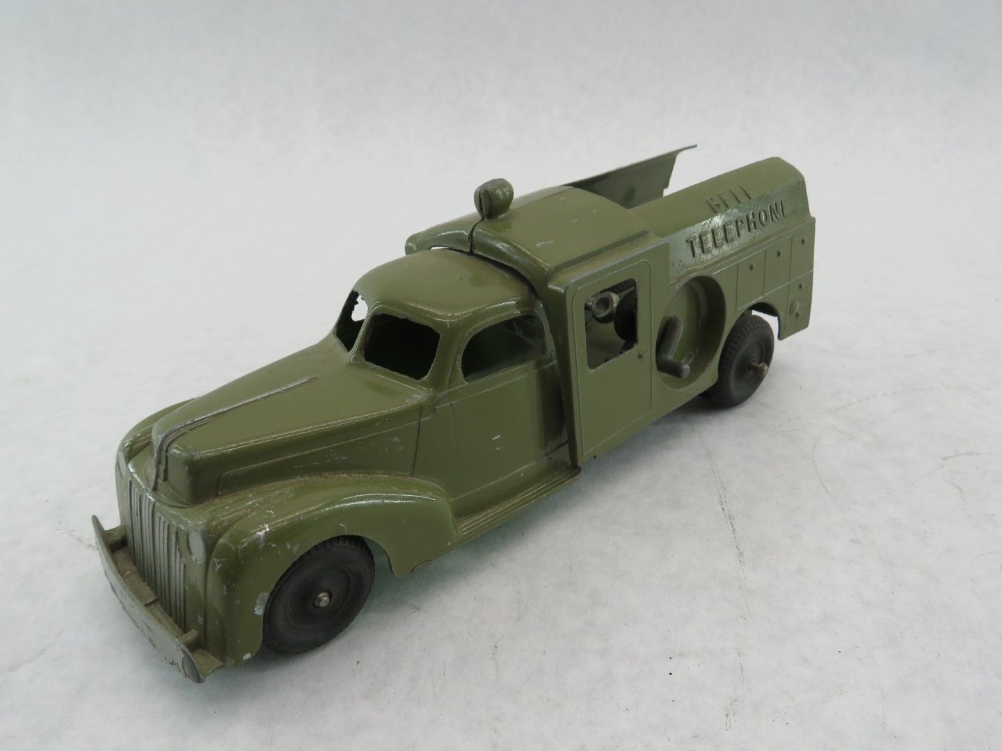 Olive green vintage toy telephone truck. 