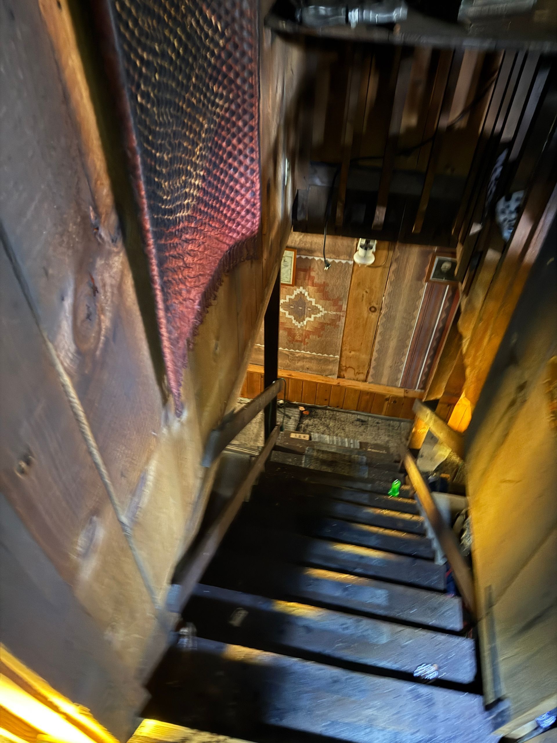 Wooden staircase leading downwards.