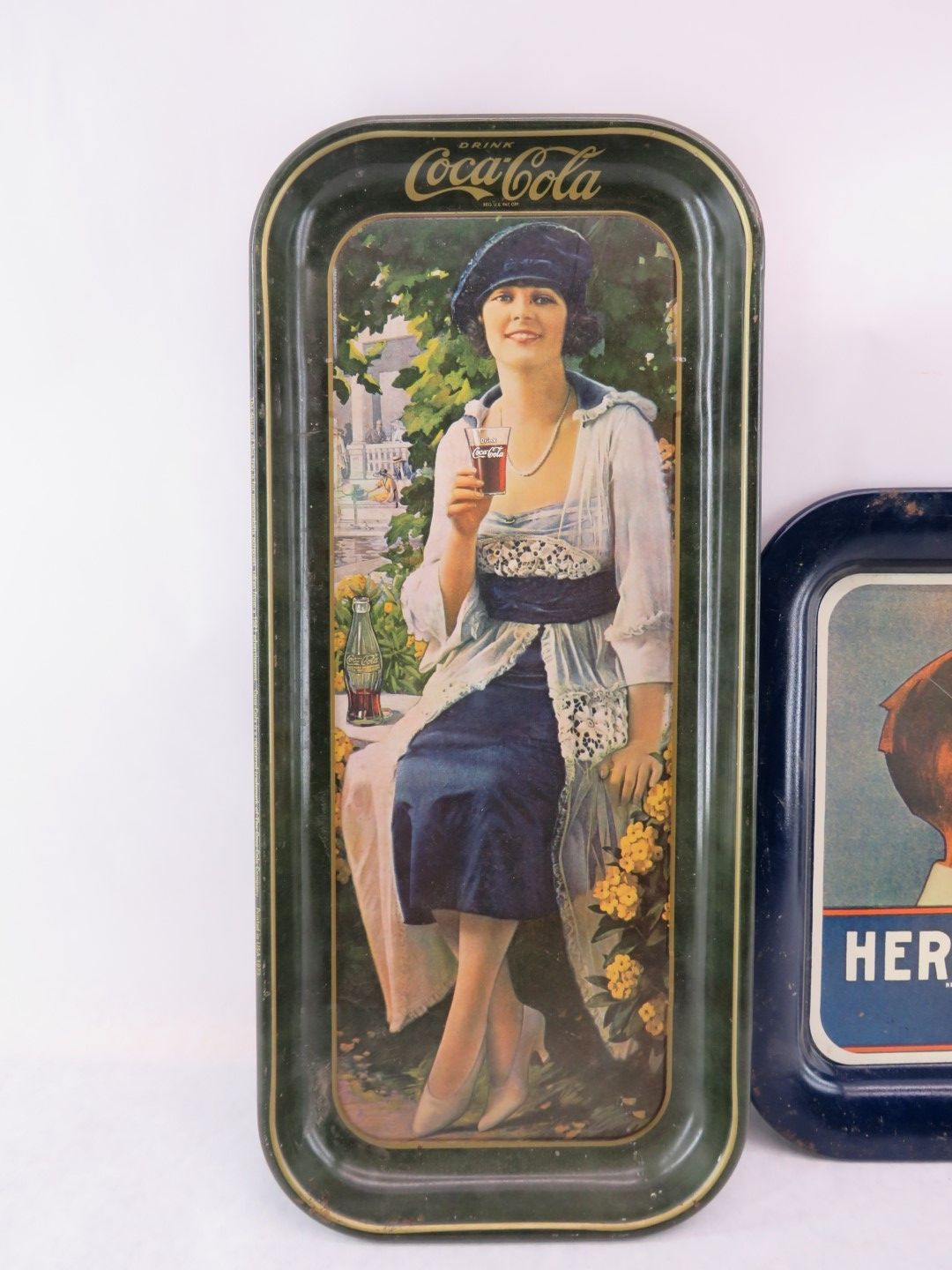 Vintage Coca-Cola tray with woman in a hat holding a glass. Dark green frame.