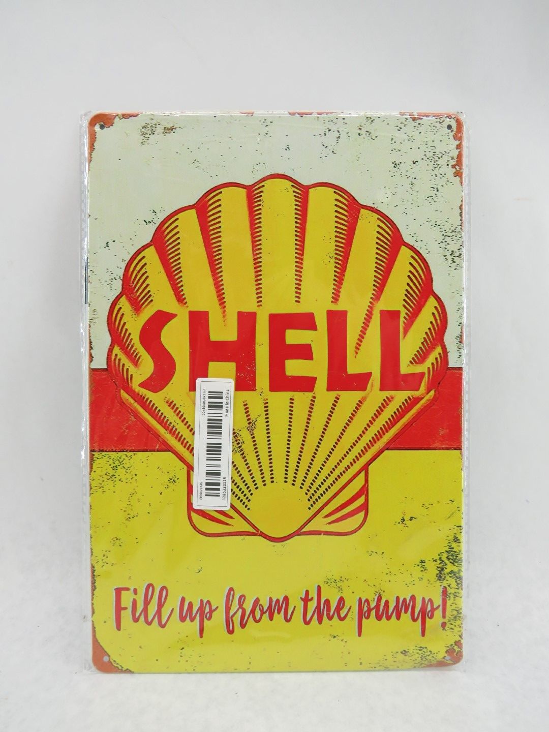 Shell gas station sign with a yellow shell logo on a red and yellow background.