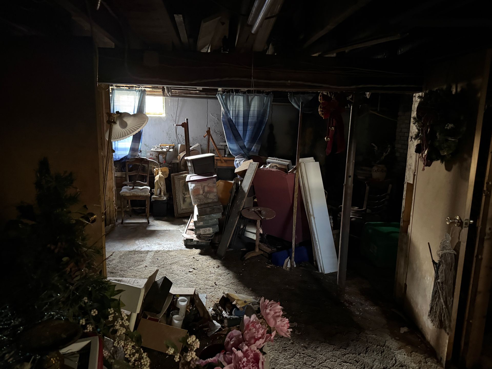 Basement with furniture and decorative items.