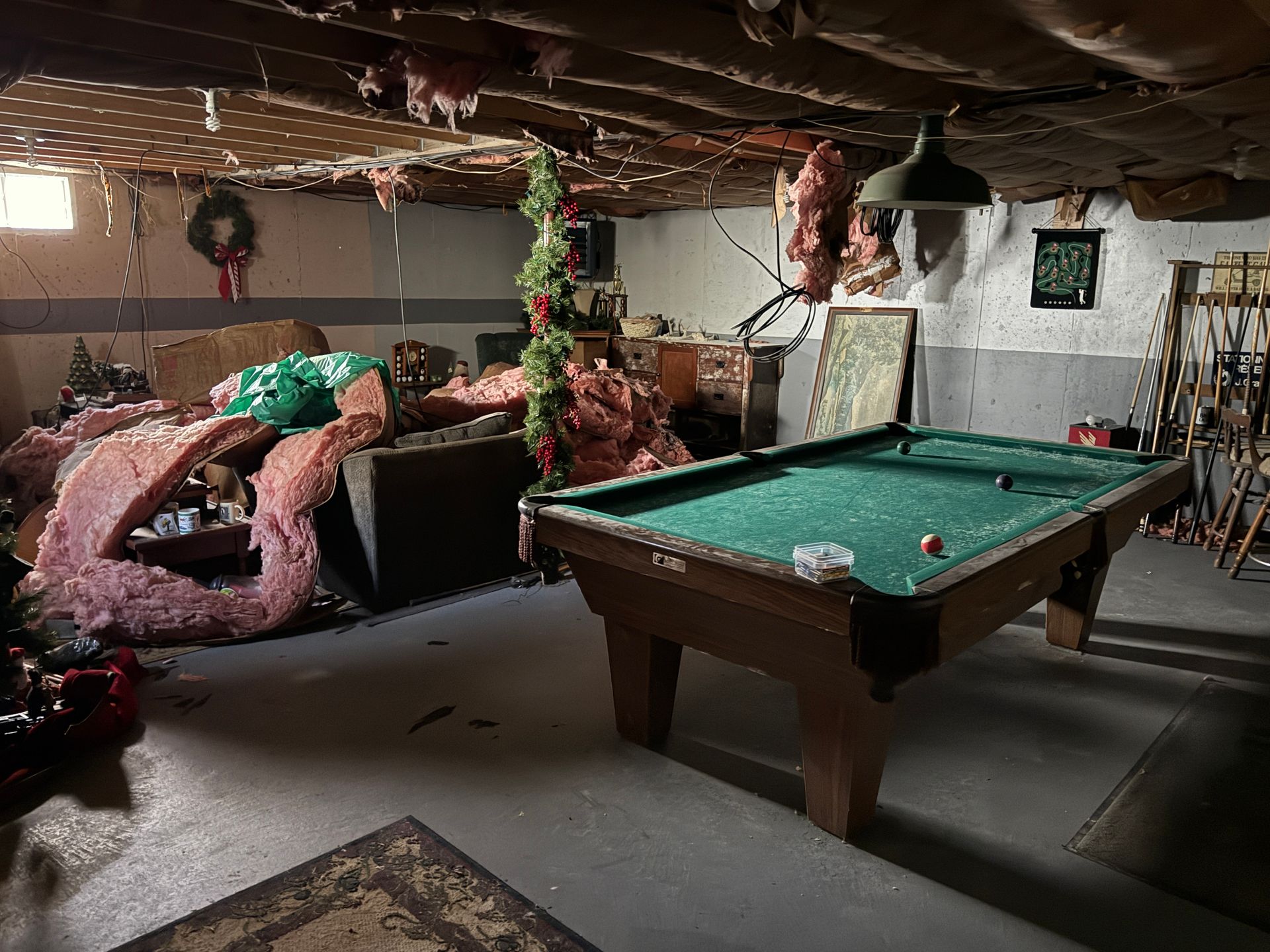 Basement with a pool table.