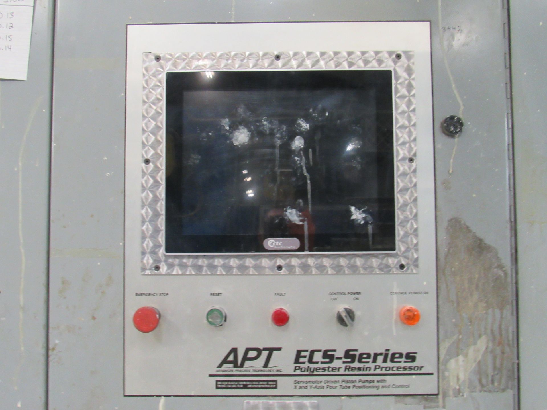 Control panel with touchscreen, buttons, and dials, labeled 