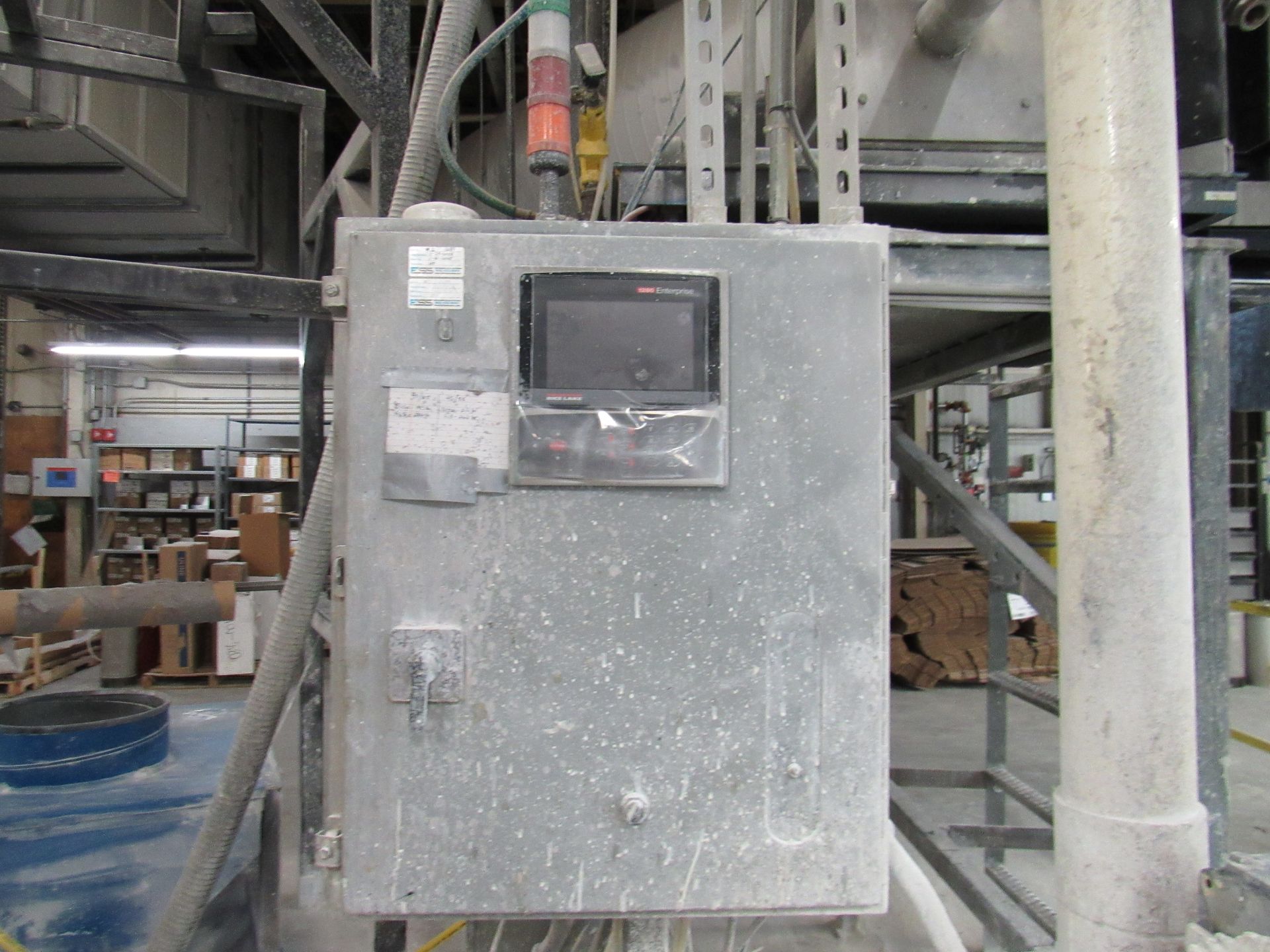 Gray industrial control panel with a screen, buttons.