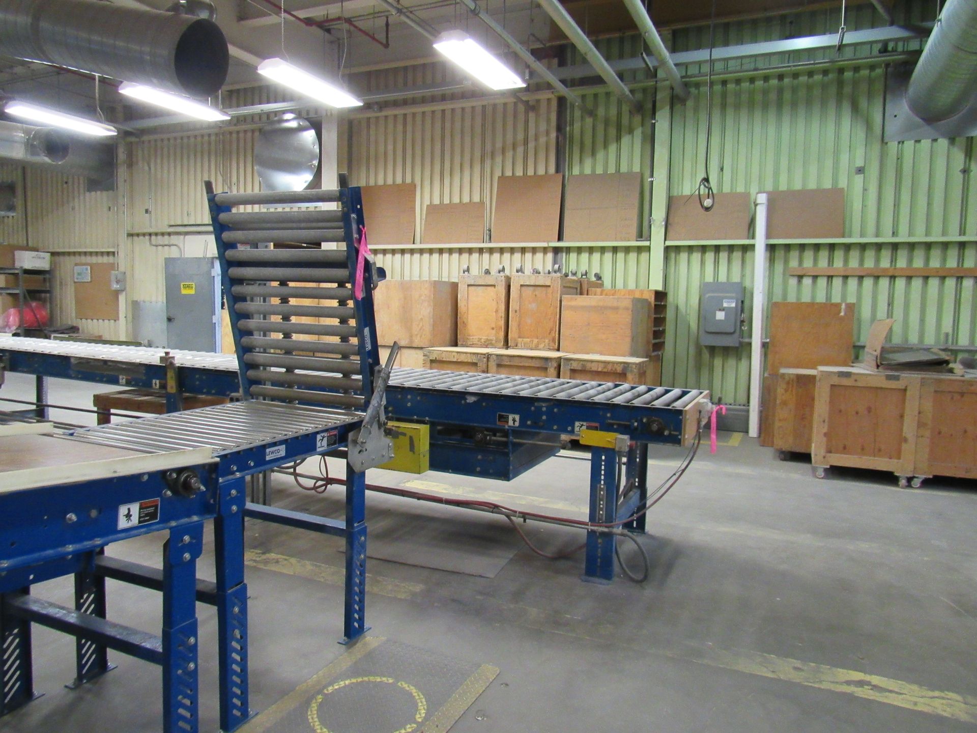 Factory interior with conveyor belts.