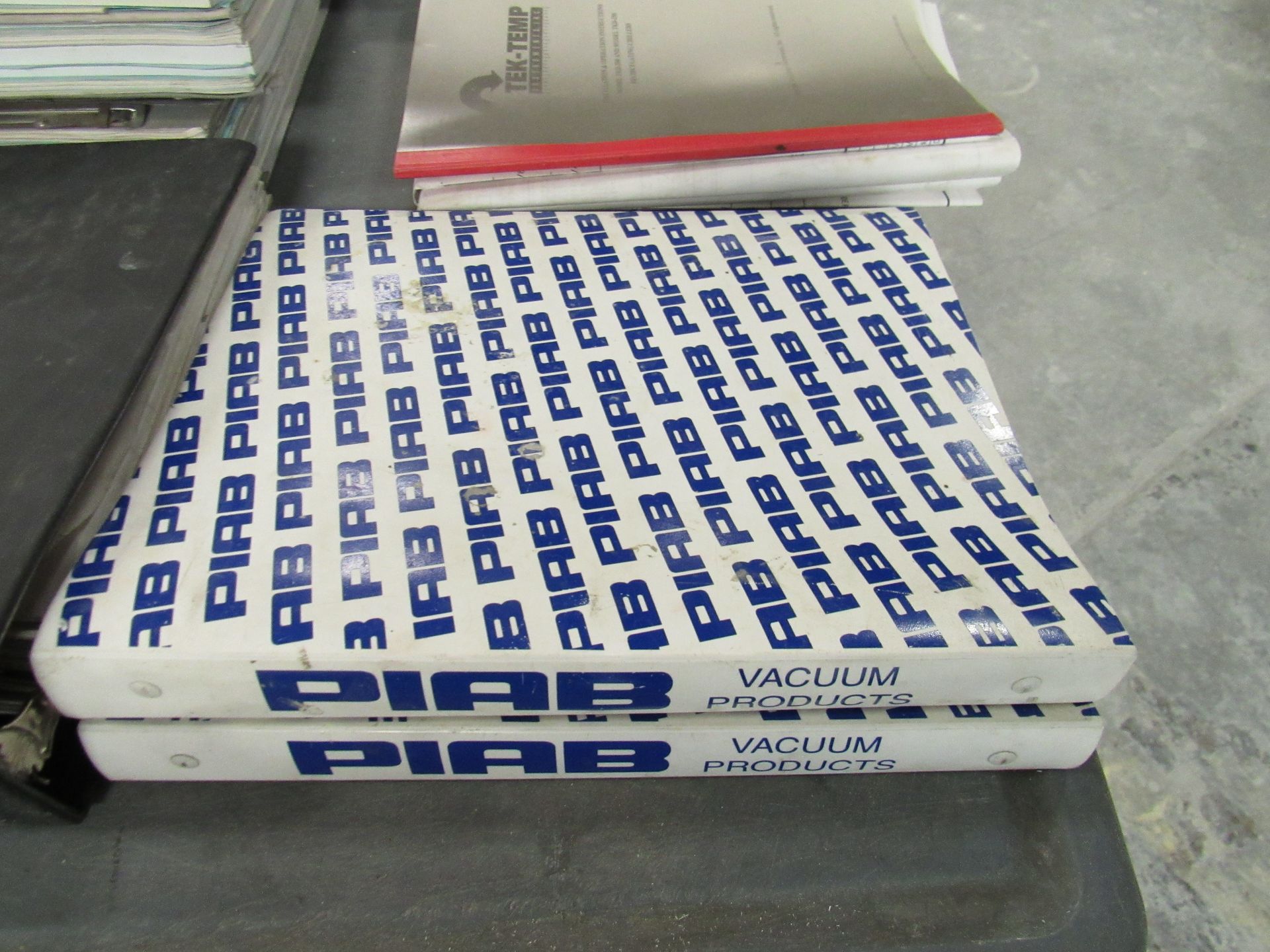 Two PIAB Vacuum Products boxes stacked. White with blue text.