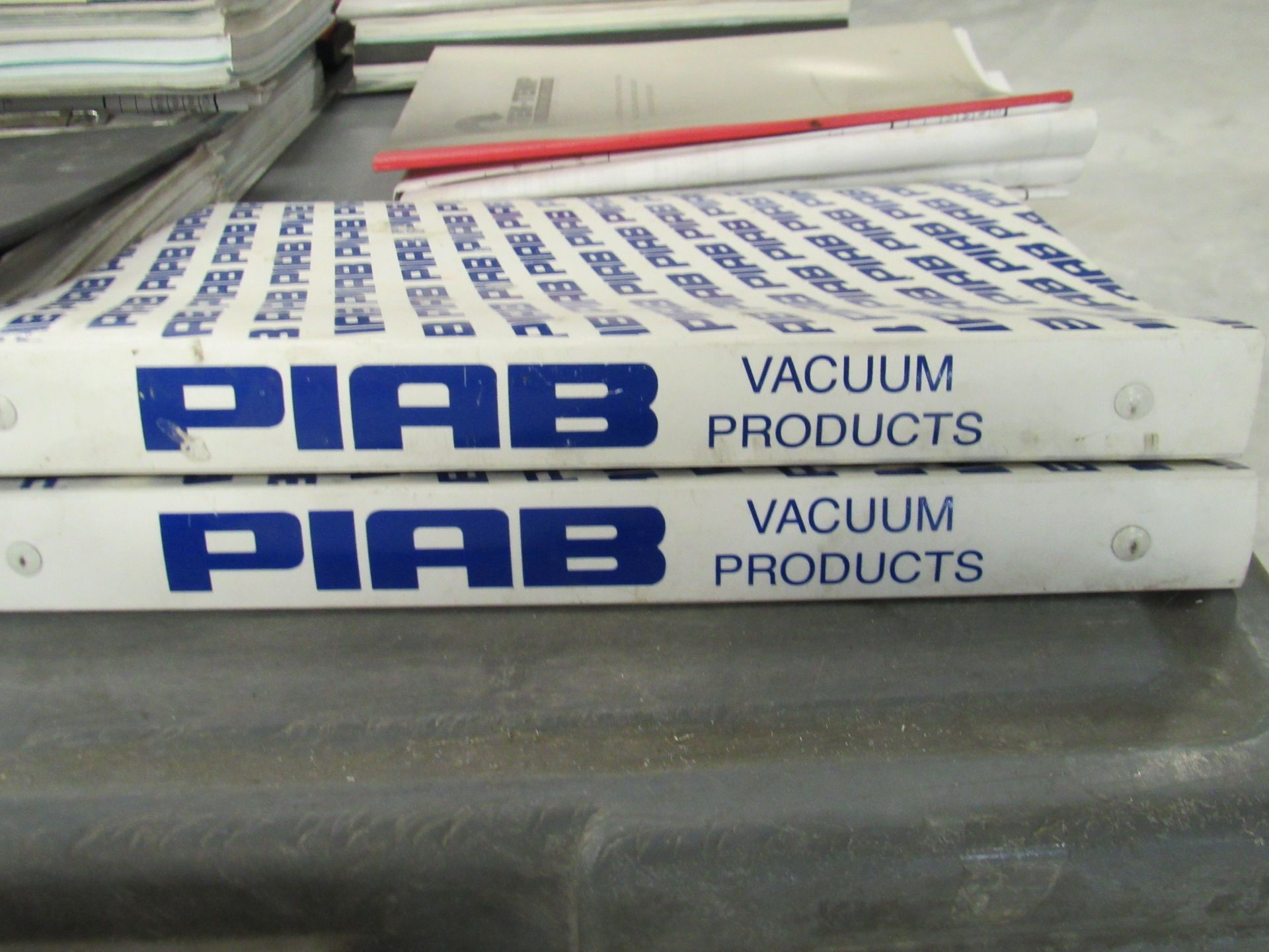 Two white binders labeled 