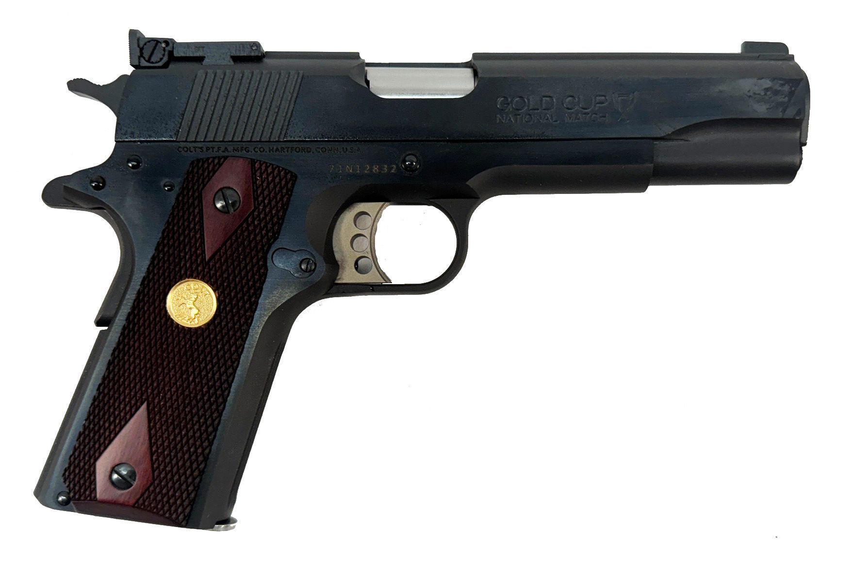 Dark blue and silver handgun with wood grips and a gold emblem.
