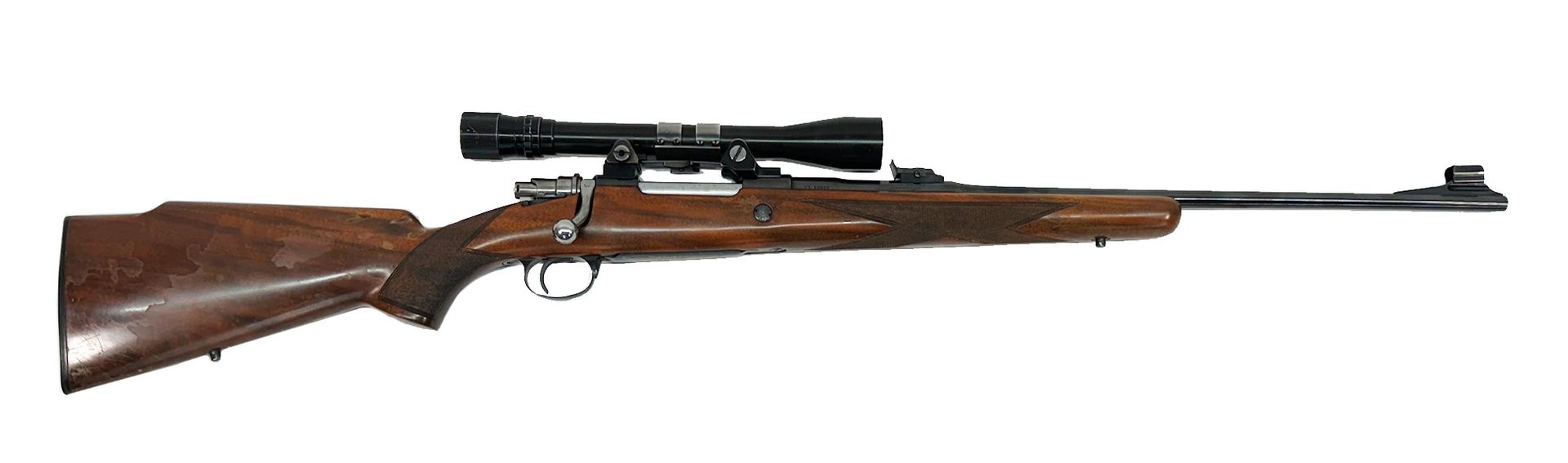 A rifle with a scope, wooden stock and barrel.