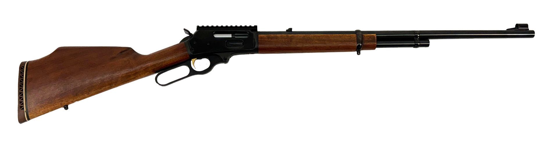 Lever-action rifle, wooden stock, black barrel and receiver, resting on a white surface.