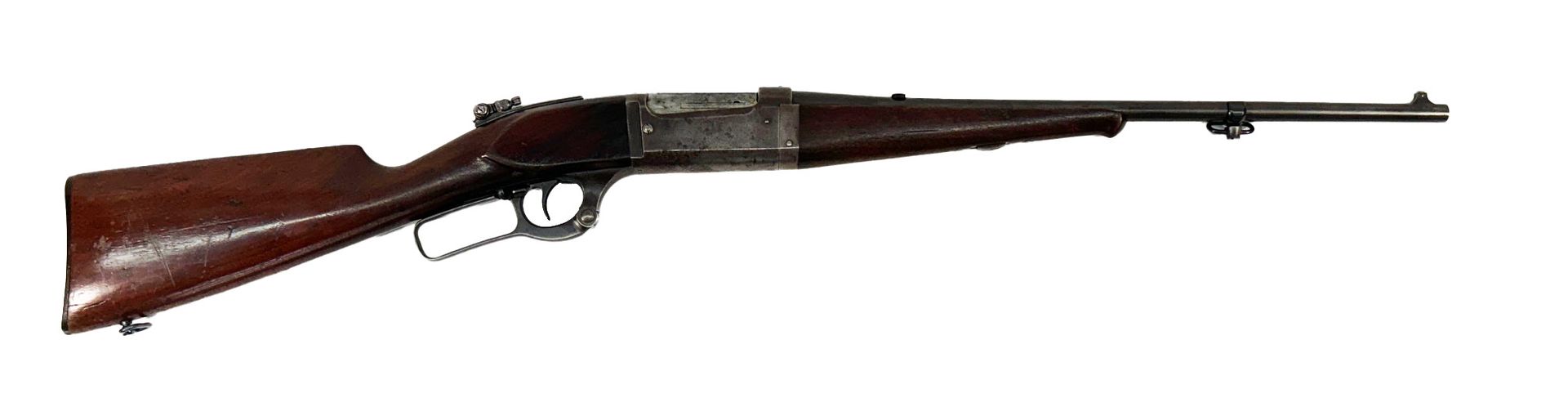 A rifle with a wooden stock, long barrel, and a lever-action mechanism.