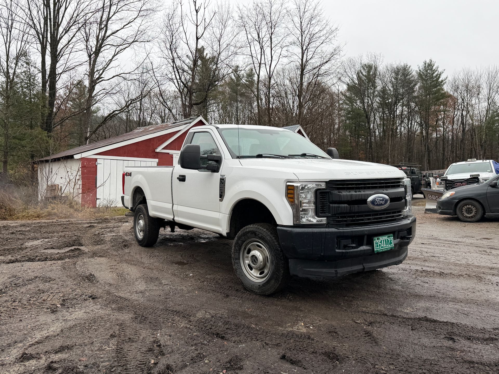 White Ford pickup truck parked.
