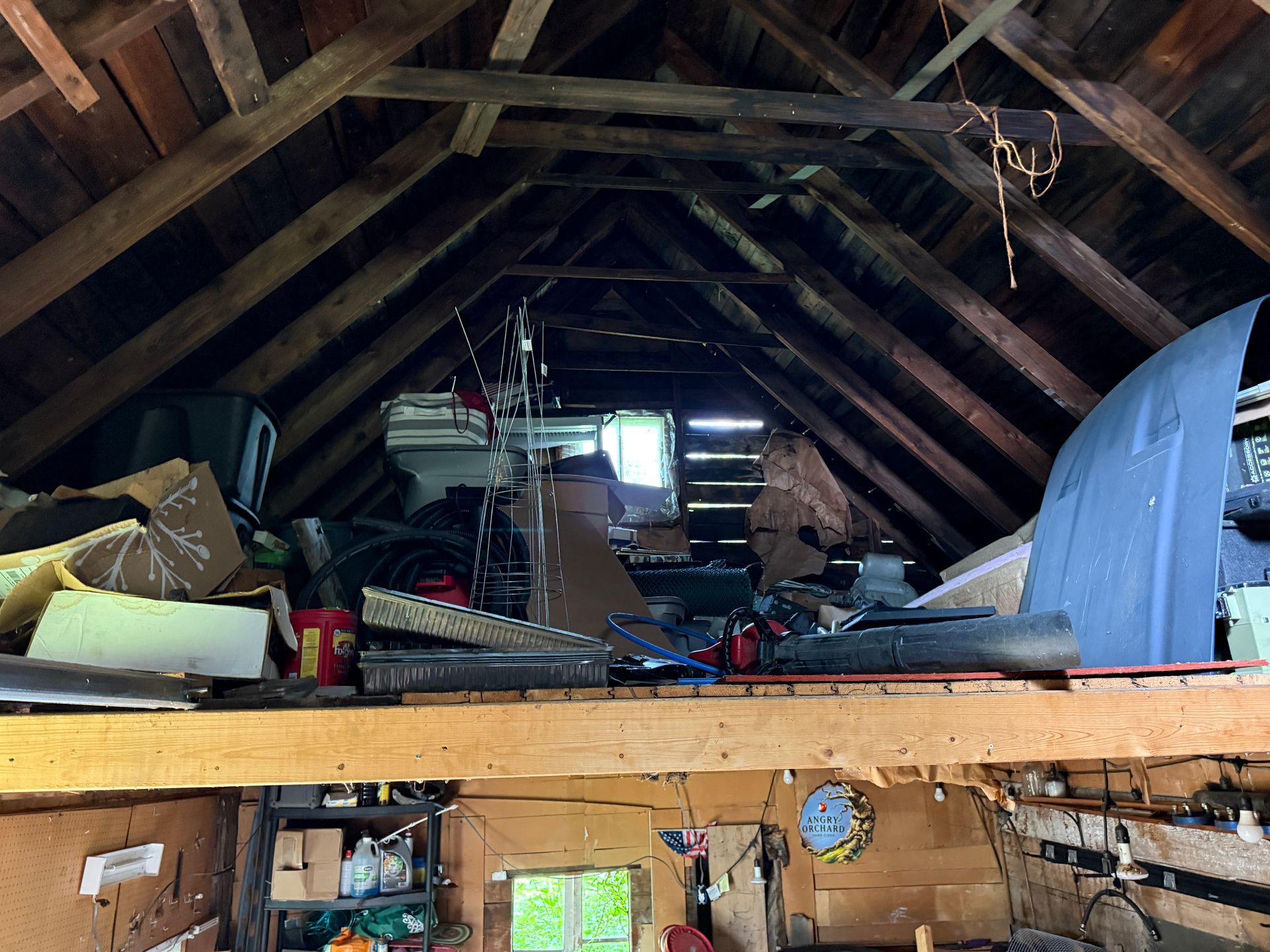 attic with exposed wooden beams