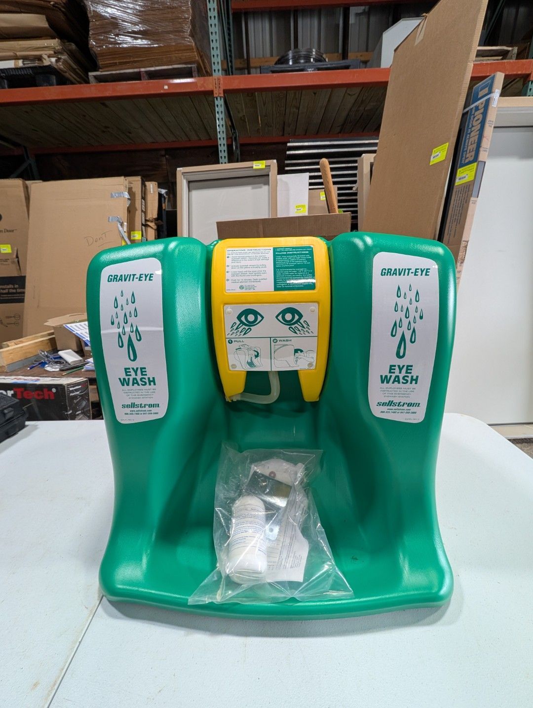 Green and yellow free-standing foot sanitizer dispenser