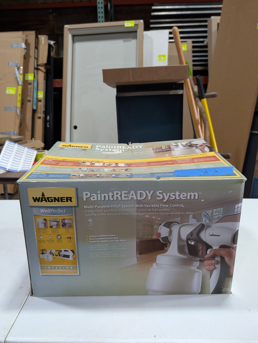 Wagner PaintREADY System box on a shelf in a warehouse, with a spray gun graphic on the front