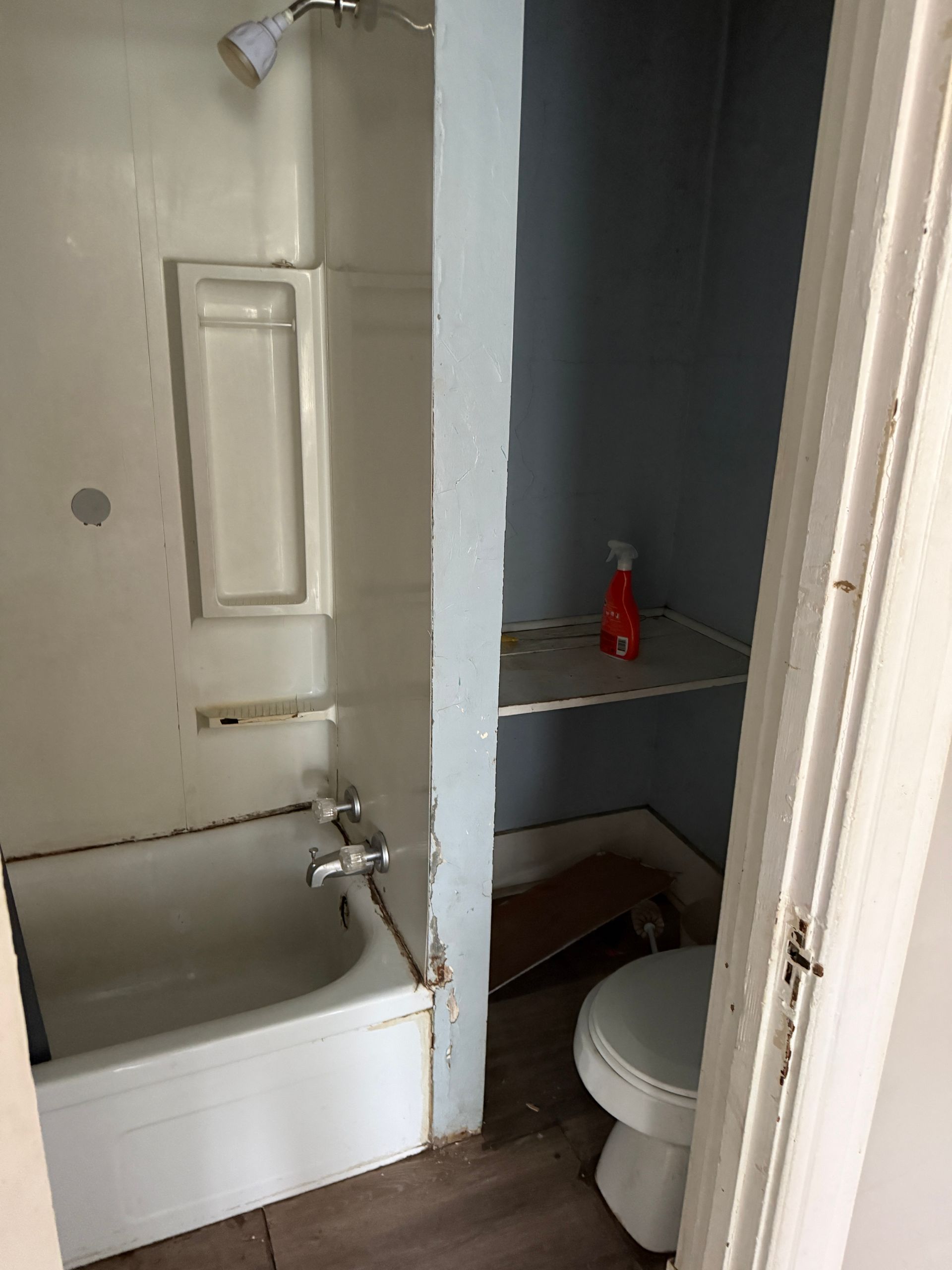 Small bathroom with a bathtub, toilet