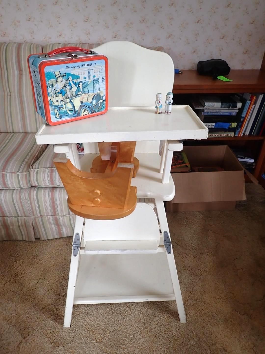 White toddler high chair with tray