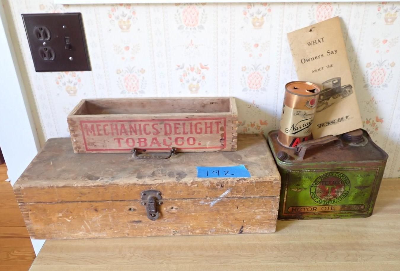 Old wooden box and tins on a table, with a Mechanics Delight tobacco crate