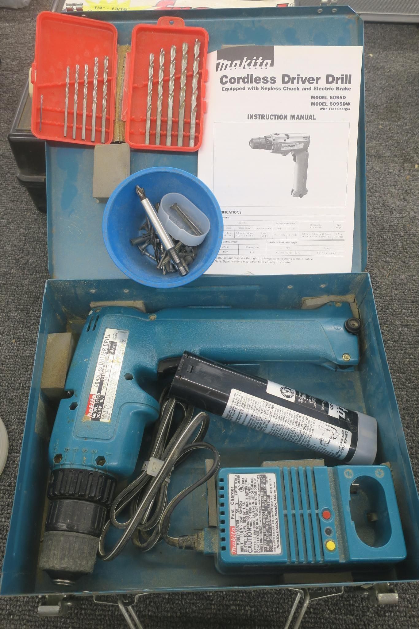 Blue tool kit with cordless drill, bits, and accessories in a case