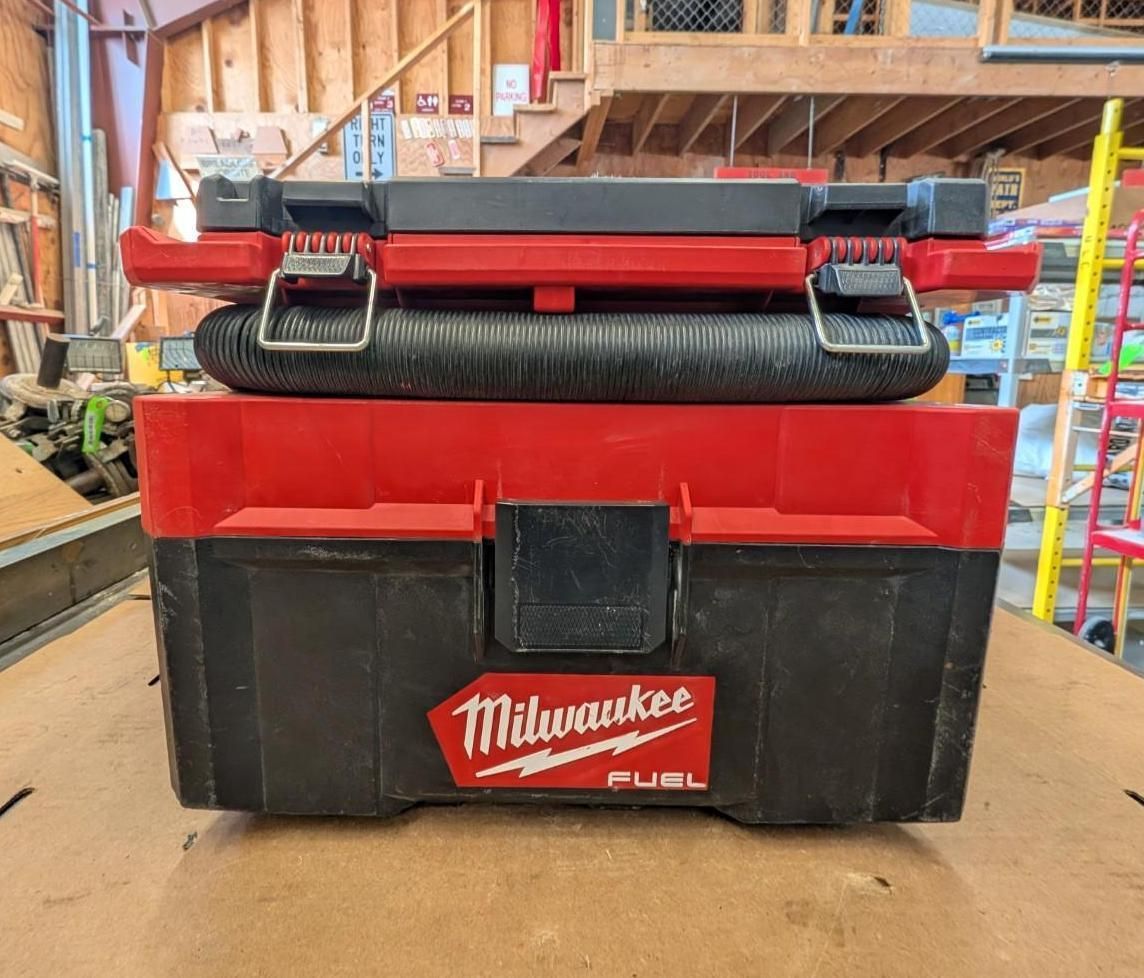 Red and black Milwaukee rolling tool chest in a workshop